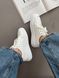 Жіночі білі шкіряні кеди &mdash; стильне та комфортне взуття 5211220 фото 1